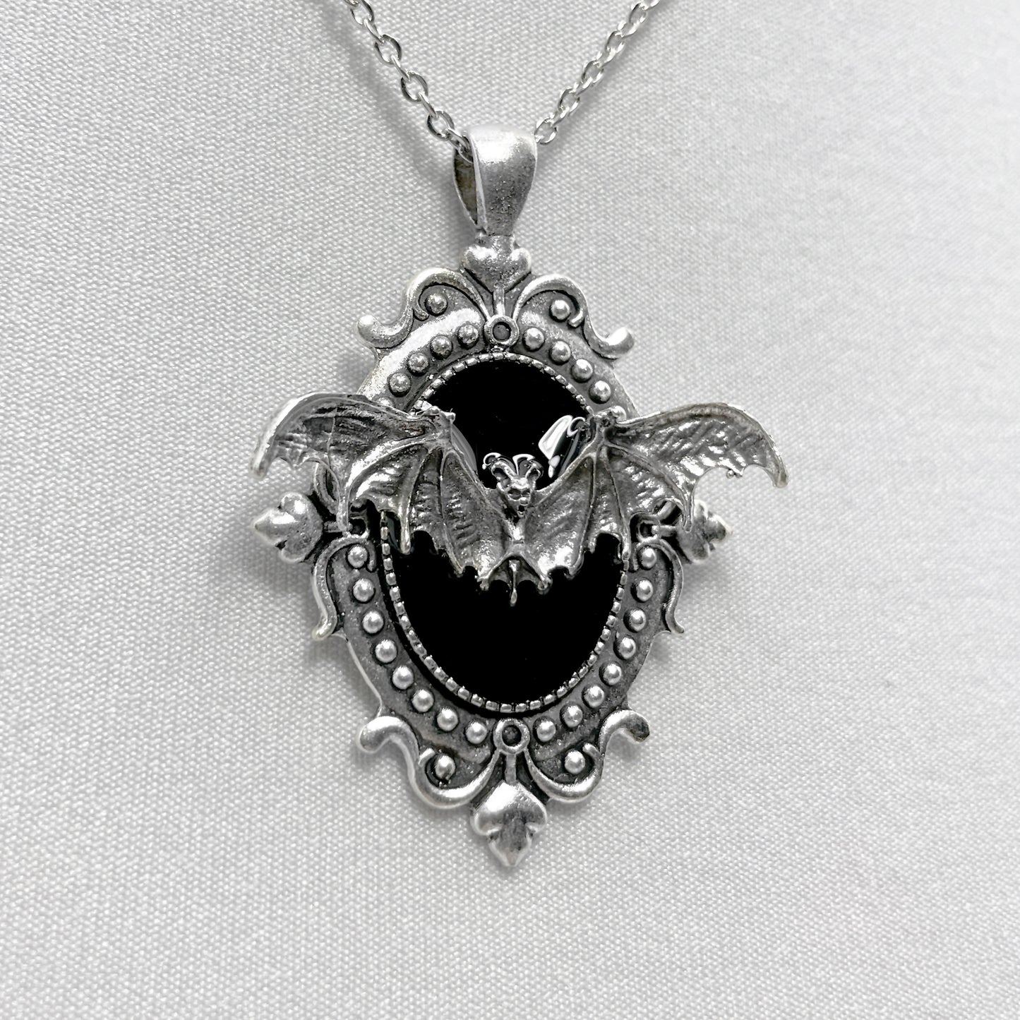 Silver Flying Bat on Black Victorian Pendant
