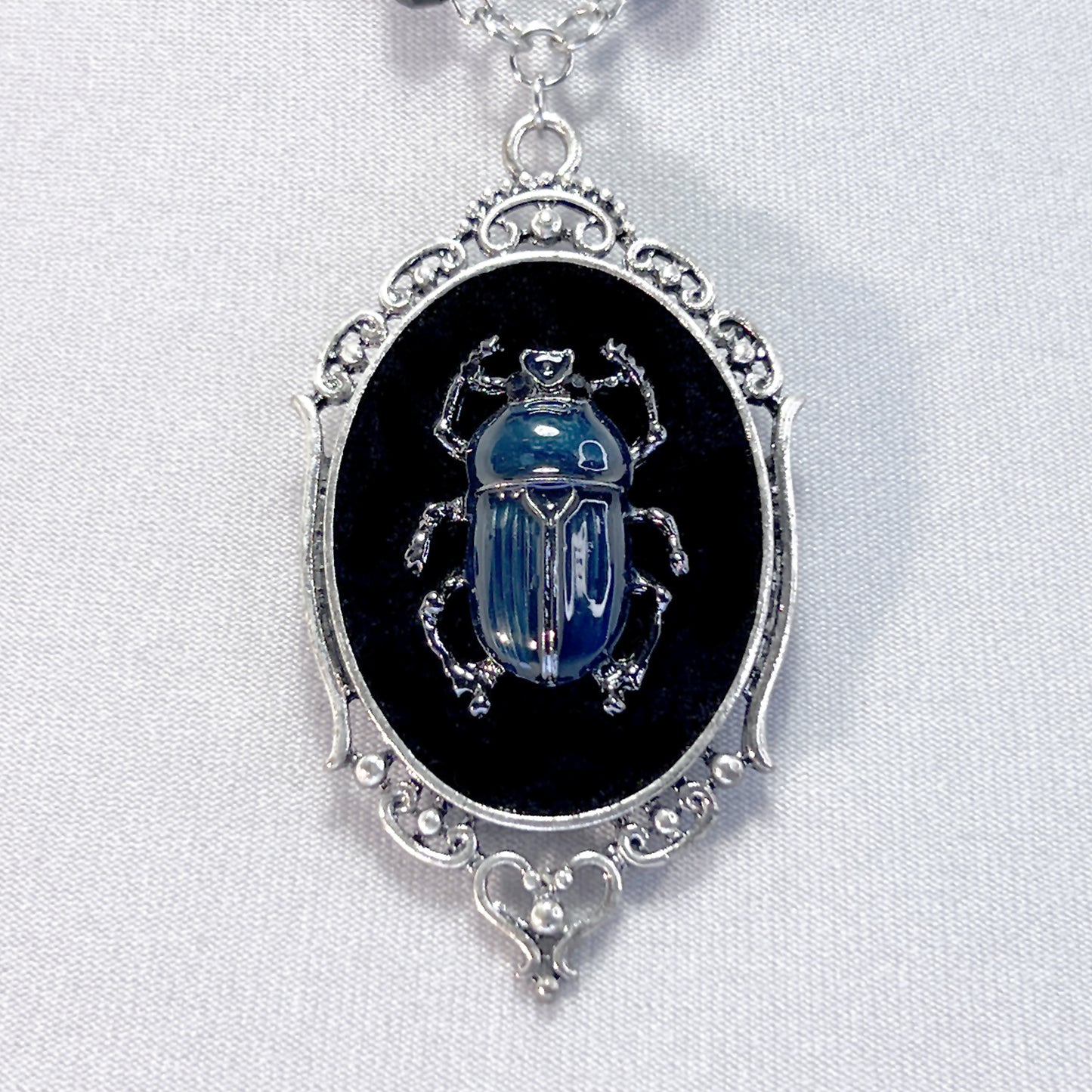 Blue and Silver Beetle on Beeded Chain
