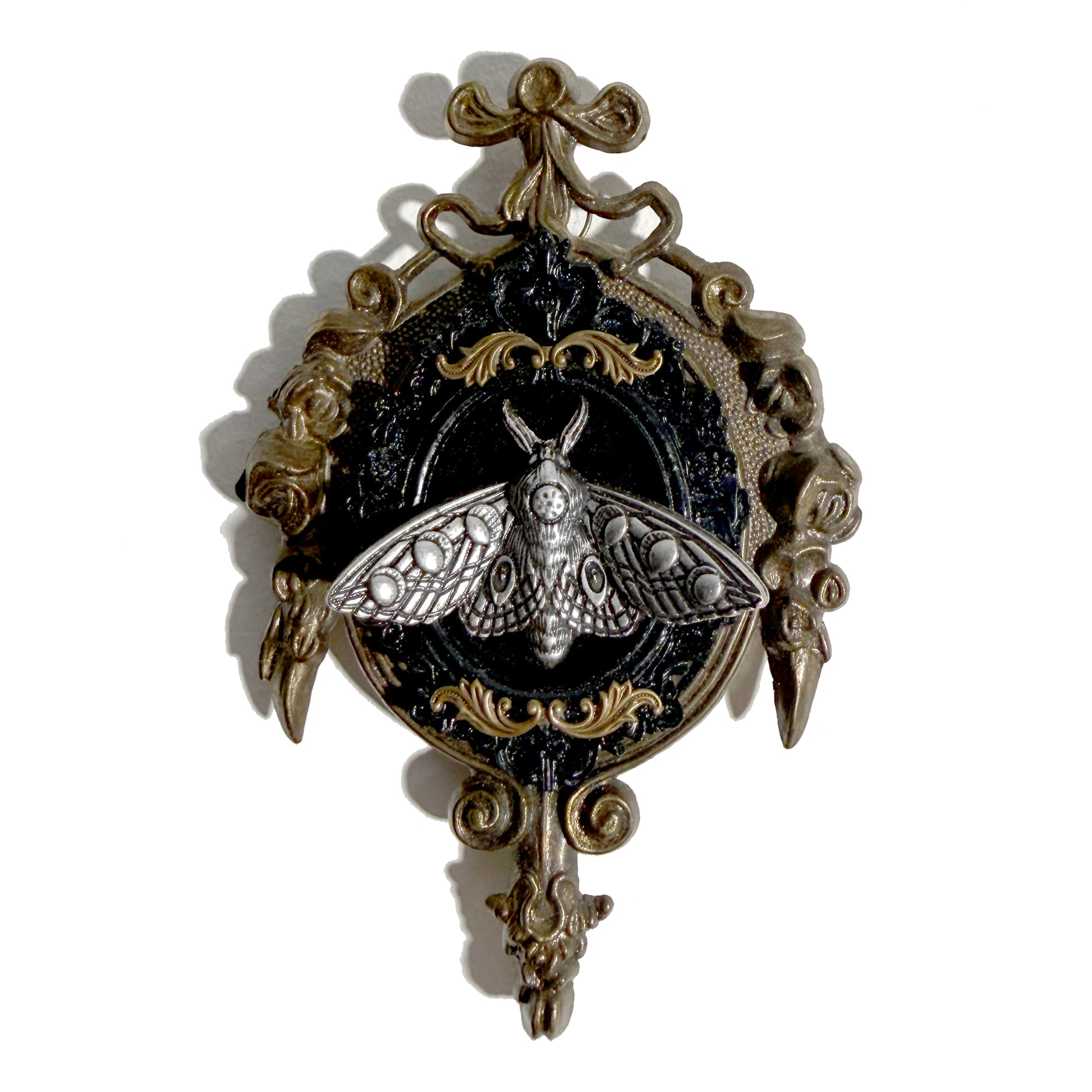 Decorative antique frame with silver moth fairy on black velvet 