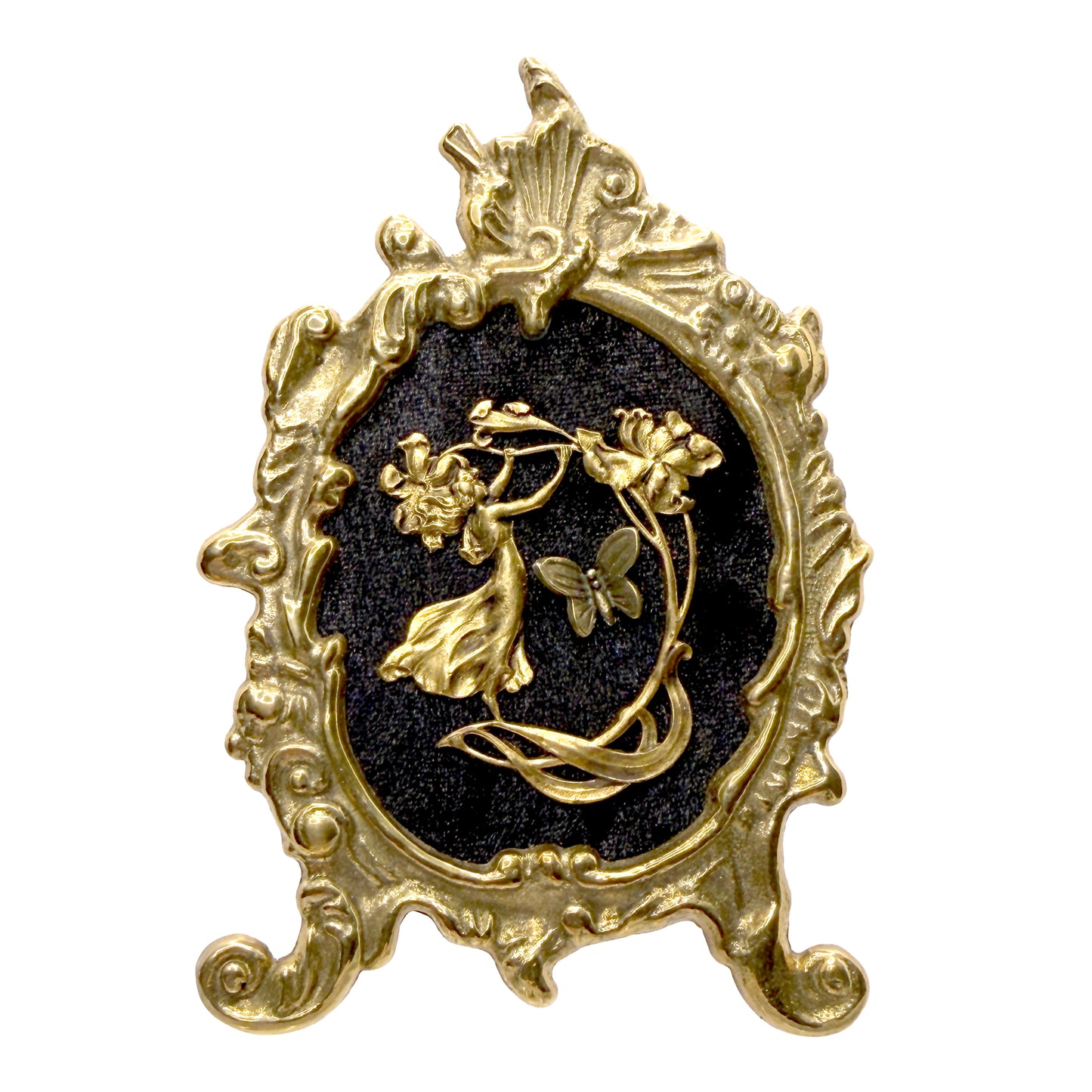 Decorative antique frame with gold fairy on black velvet featuring a floral design on a white background