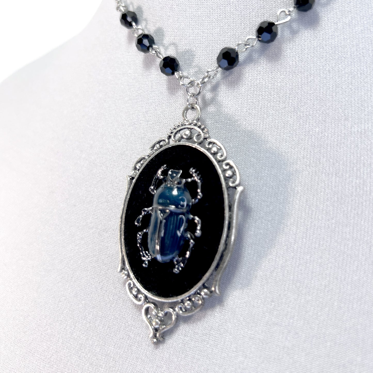 Blue and Silver Beetle on Beeded Chain