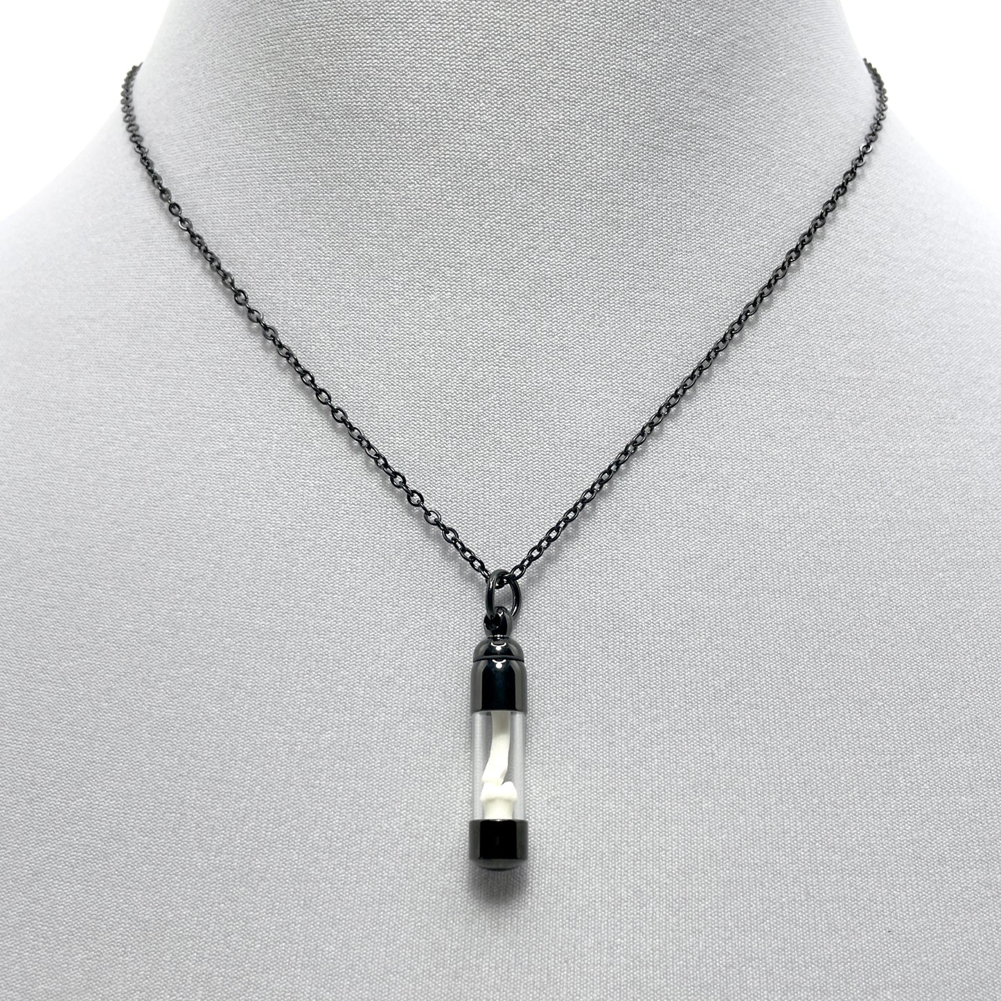 Tiny Black Glass Vial Filled with Little Bones